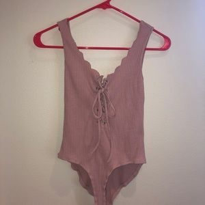 Pink body suit worn maybe once or twice !